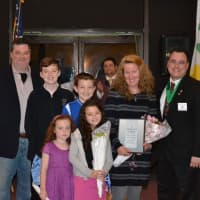 <p>Past Grand Knight George Ribellino presents Parish Family of the Year to the Mitchells</p>