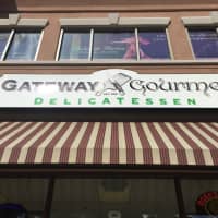 <p>Gateway Gourmet&#x27;s storefront sign.</p>