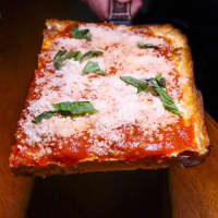 <p>A slice of Nonna Pizza made fresh daily.</p>