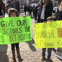 <p>Ossining students, parents and teachers took part in a rally at Market Square on Thursday, March 22 to protest drastic cuts in state aid. Children shouted: &quot;Show me the money,&quot; to Gov. Andrew Cuomo of neighboring New Castle.</p>