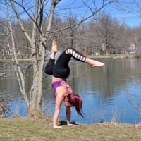 <p>Feinberg handstands in Wooddale Park in Woodcliff Lake.</p>
