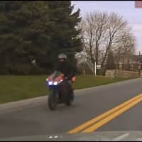 <p>Still from dash cam footage of a motorcyclist who fled and eluded police in Lancaster County, Pa.</p>
