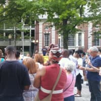 <p>A crowd gathers on the McLevy Green in Bridgeport on Sunday for a vigil to protest violence in Charlottesville.</p>