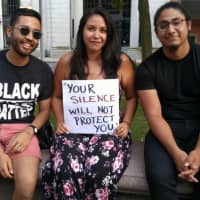 <p>Three of the participants at the vigil in Bridgeport on Sunday to protest violence in Charlottesville share a message.</p>