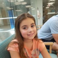 <p>Gabriella Larsen, 9, of Mahwah, successfully and safely had a benign brain tumor removed last year. Her family is grateful -- and paying it forward.</p>