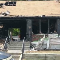 <p>A woman died in the fast-moving house fire at 335 Seltsam Road in Bridgeport early Sunday, fire officials said.</p>