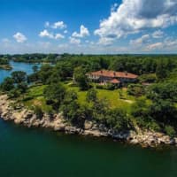 <p>The 63-acre estate on Great Island in Darien includes this stone mansion.</p>