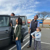 <p>The Lemus family watches the eclipse.</p>