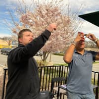 <p>Russ Donahue and Michael Mounter snap photos of the total solar eclipse.</p>