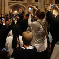 <p>Thursday evening just before a Vespers service as thousands of people -- including four nuns from the Mariandale Convent -- take personal photos of Pope Francis as he proceeds into St. Patrick&#x27;s Cathedral.</p>