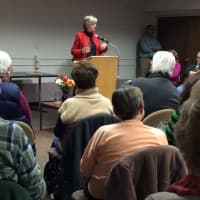 <p>Jane Bryant Quinn commands the room as she talks about financial planning for retirement Sunday at the Danbury Public Library.</p>