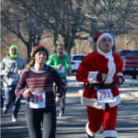<p>Runners head down the homestretch at last year&#x27;s Jingle Bell Run.</p>