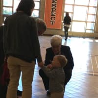 <p>Lt. Gov. Nancy Wyman and Terry Jones, owner of Shelton&#x27;s Jones Family Farms, greet a young visitor at the memorial service for Philip H. Jones Jr. </p>
