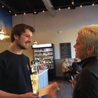 <p>Tyler Holder of SoNo Baking &amp; Cafe was named the winner of the Darien Chamber of Commerce&#x27;s Employee of the Year award. He accepts the award from Gina Zangrillo of Darien Sport Shop. The award is named after her late father, Stephen.</p>
