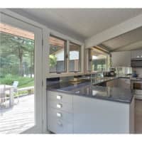 <p>The home at 54 Lower Shad Road in Pound Ridge features a kitchen with updated appliance and granite countertops.</p>