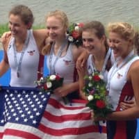 <p>Kelsey McGinley, left, of Westport celebrates with teammates after winning a bronze medal at the World Junior Championships.</p>
