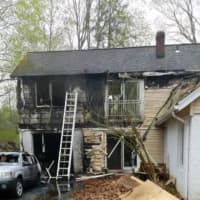 <p>The rear of a Mount Kisco home sustained damage when a car fire spread to the structure.</p>
