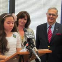 <p>Sen. David Carlucci, left, stands with Stony Point resident Lauren Shields, then 12,  as she speaks about the passage of the organ donor registry law named after her.</p>