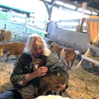 <p>Lisa Miskella at Freedom Farm Animal Sanctuary with Matilda the goat.</p>