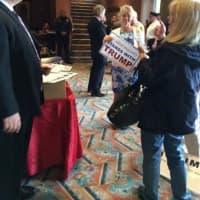 <p>Trump supporters pick up campaign signs in the lobby of the Klein on Saturday morning before the mid-day campaign rally in Bridgeport.</p>