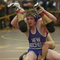 <p>New Rochelle&#x27;s Jake Logan controls the 160 pound final on his way to a title.</p>