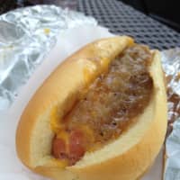 <p>A &quot;link&quot; at Lubins -N- Links in Tarrytown is covered with homemade Jubee onions and &quot;cheez,&quot; a blend of four different cheeses.</p>