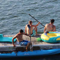 <p>Lucas Salem left, Brian Murphy (center) and Jackson Solis enjoy their time on the water.</p>