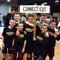 <p>Norwalk Mad Bulls wrestlers carry the Connecticut banner at the Eastern Nationals wrestling competition in Salisbury, Md.</p>