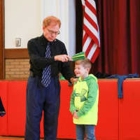 <p>Student takes part in a demonstration with Bradley Fields of &quot;MatheMagic!&quot;</p>