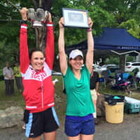 <p>Maritime Rowing Club coaches Anna Cherednikova and Yulia Chagrina celebrate the victory by its masters team.</p>