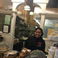 <p>Megan Bartley, from Fox Lane High School, working the Ladle counter.</p>