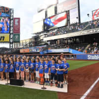 <p>The William E. Cottle Elementary School Chorus singing the national anthem at Citi Field.</p>