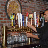 <p>Bartender Michael Roundtree pours a glass of Sam Adams Oktoberfest last night at Jersey Boys in New Milford.</p>