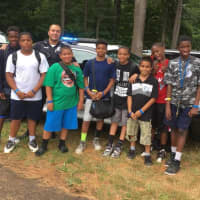 <p>Monroe Police Officer Omar Wahib recently visited Camp Courant for Law Enforcement Day.</p>
