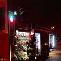 <p>Firefighters returning equipment to Engine-Rescue 203</p>
