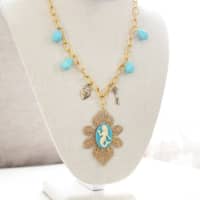 <p>A vintage-style mermaid necklace Markowski designed</p>