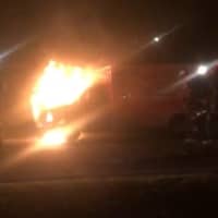 <p>A rig belonging to the New City Ambulance Corps goes up in flames on Congers Road Thursday night. The emergency medical technician driving it escaped unharmed, thanks to the quick actions of a passerby.</p>