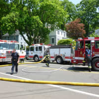 <p>Part of the Norwalk fire apparatus called to the scene of a Tuesday afternoon fire at 43 East Ave. in Norwalk.</p>