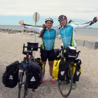<p>Westport resident Alec Bernard, right, and friend Allie Wills kick off their more than 3,000 mile charity bike journey from Westport&#x27;s Compo Beach last Friday. </p>