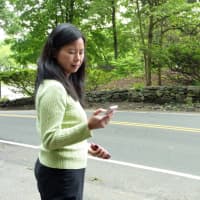 <p>Westport resident Betty Tsang checks to see when her daughter&#x27;s school bus is due to arrive Monday by using the &quot;Where&#x27;s Our School Bus?&quot; app she and husband Norman created.</p>