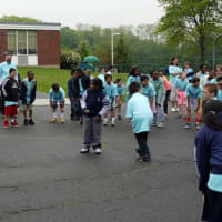 <p>Ridgefield teacher and coach Tom DiMarzo led the students in several rounds of Simon Says outside Scotland Elementary School.</p>