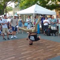 <p>A dancer from Studio 44 Dance and Fitness in Westport wows a crowd on Main Street Thursday during the Art About Town street party.</p>