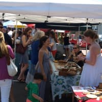 <p>Shoppers browse the stalls at the PopShop Market in Fairfield Saturday afternoon. </p>