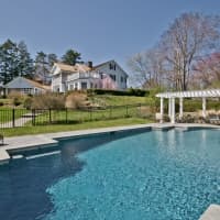 <p>This home at 215 Greenfield Hill Road, listed by Melanie Smith, has a pool situated away from the house.</p>