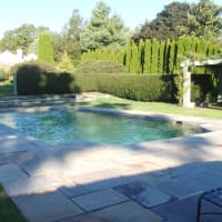 <p>This home at 775 Sasco Hill Road in Fairfield, listed by Melanie Smith, is neatly landscaped around the pool.</p>