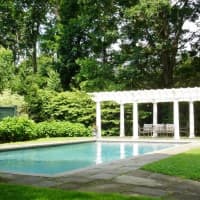 <p>The home at 1100 Pequot Ave. in Southport, listed by Melanie Smith, includes a nice pool surrounded by mature landscaping.</p>