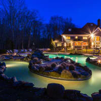 <p>The property at 1 Stillwater Place in Bedford, marketed by Douglas Elliman, features a 80-foot lazy river pool.</p>