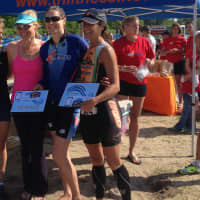 <p>Fairfield&#x27;s Lydia Heilmann (second from right) the winner of Sunday&#x27;s Seaside Sprint Triathlon in Bridgeport, stand with (from left) race director Pascale Butcher, runner-up Whitney Ross and third-place finisher Karen Newman.</p>