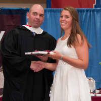 <p>Abigail Hassett of Katonah, who received two awards at Harvey&#x27;s June 6 commencement, the Photography Prize and the Girls&#x27; Athletic Prize, is congratulated by Upper School Head Phil Lazzaro.</p>