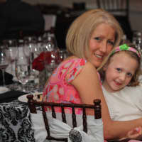 <p>Linda Queenan and her &quot;tiny miracle&quot; daughter, Lilah, of Ridgefield enjoy the Tiny Miracles Foundation gala in Darien.</p>